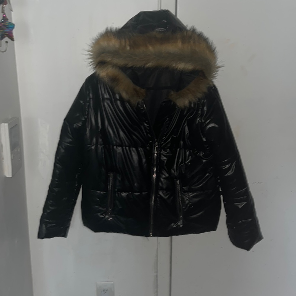 Warm puffer black never been worn. Super trendy. Faux fur hood.